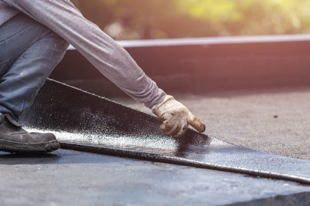 Professional Basement Waterproofing technician working in Mansfield Center, MA